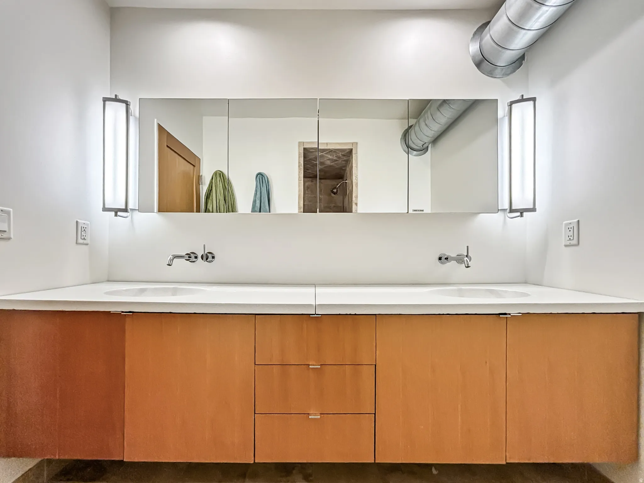 Bathroom with double vanity and a shower