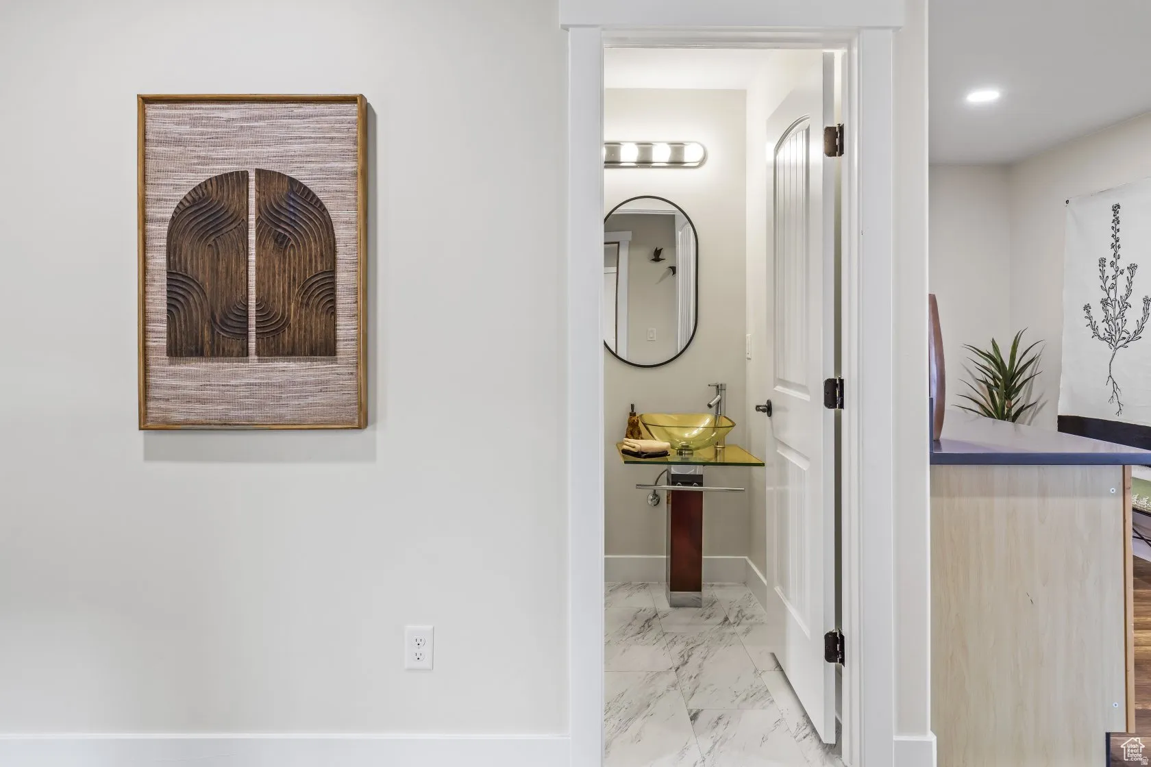 Bathroom with light marble finish floors and baseboards