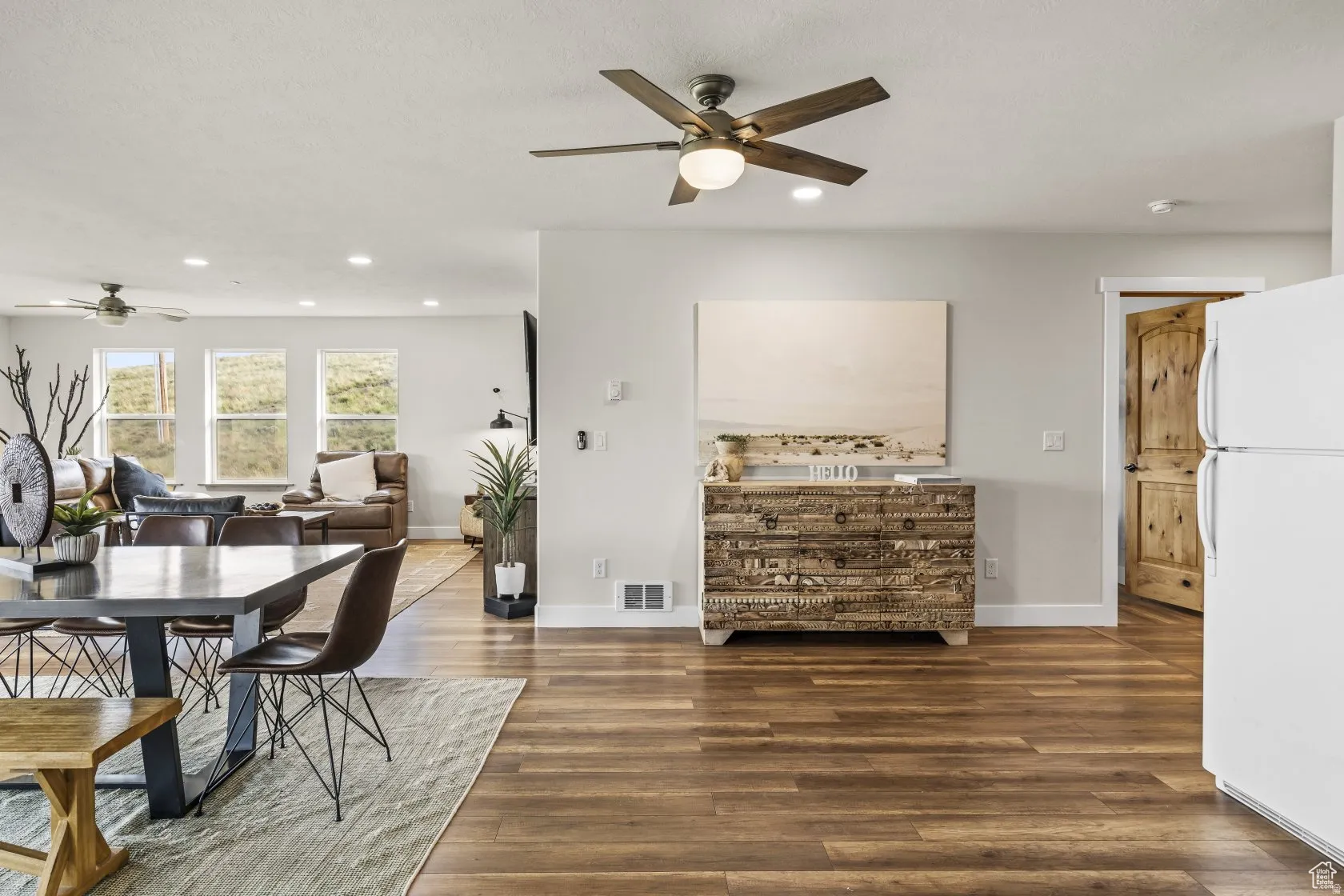 Dining area with ceiling fan, dark wood-style floors, and recessed lighting