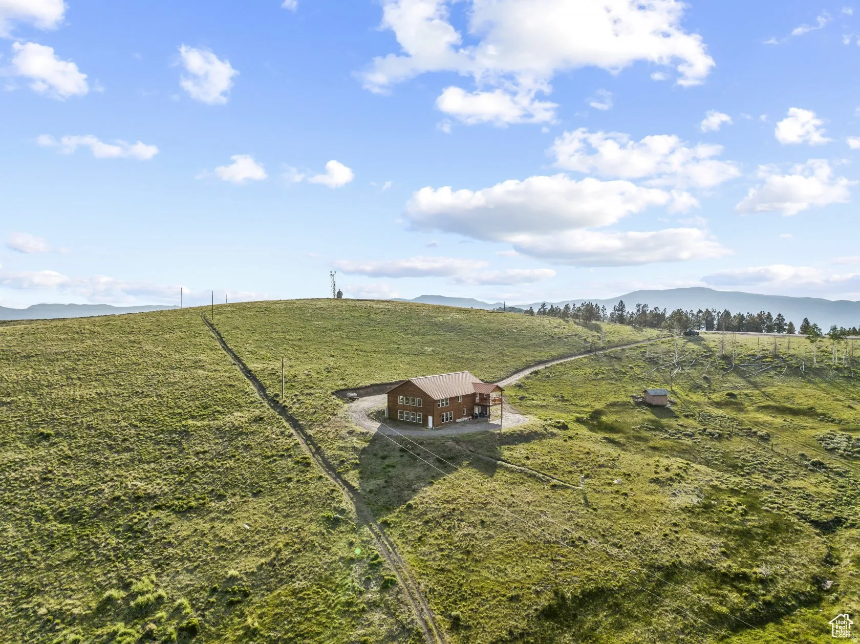 View of yard with a view of countryside, a mountain view, and an outdoor structure