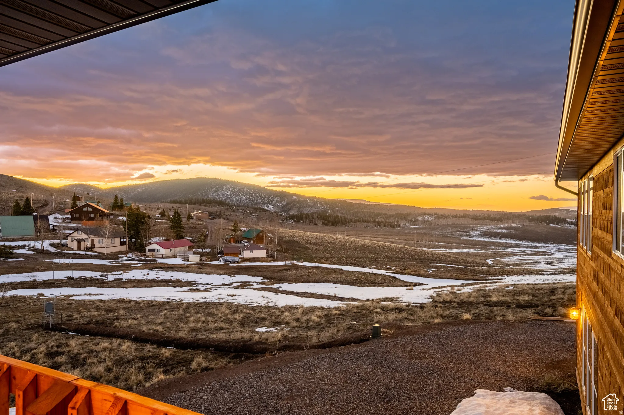 Snowy yard with a mountain view