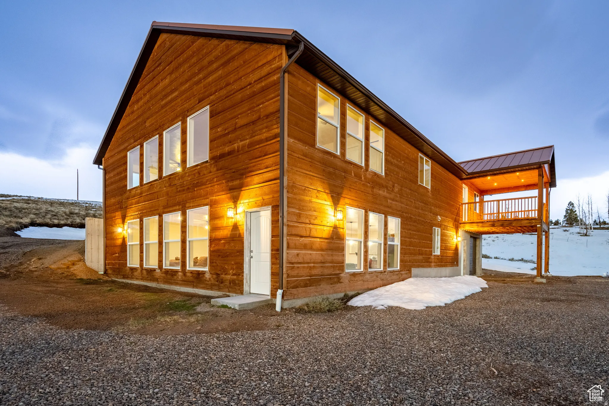 Rear view of property with a standing seam roof