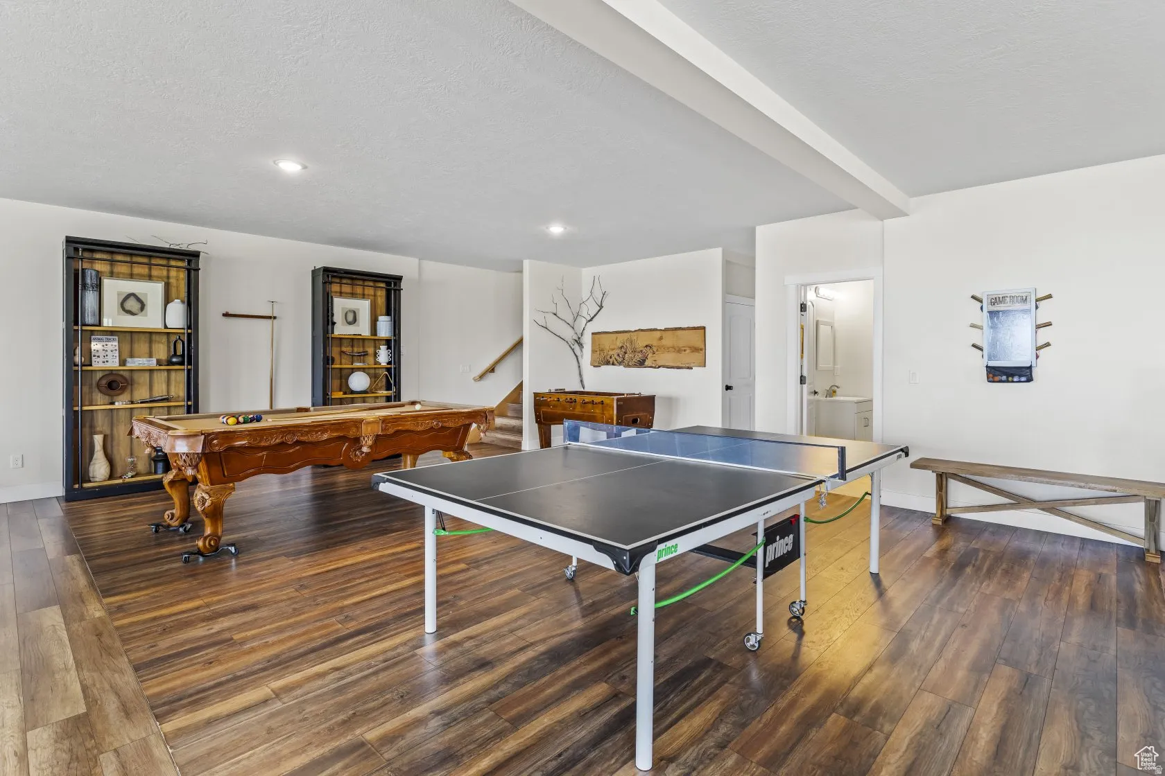 Game room featuring billiards, dark wood finished floors, and beam ceiling