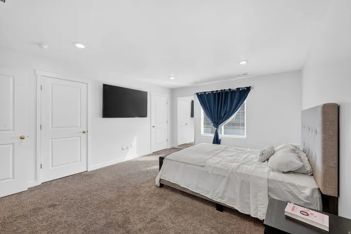 Bedroom with carpet flooring and recessed lighting