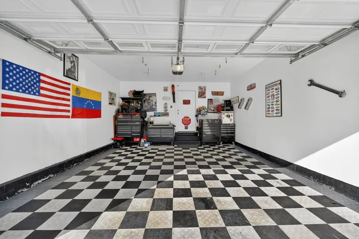 Garage featuring baseboards