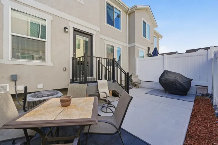 View of patio with grilling area and outdoor dining area
