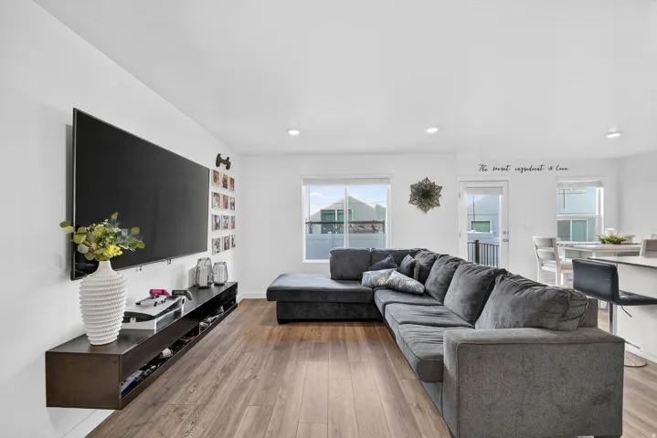 Living room with wood finished floors and recessed lighting