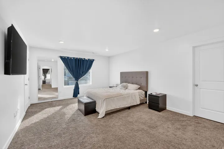 Bedroom featuring carpet floors and recessed lighting