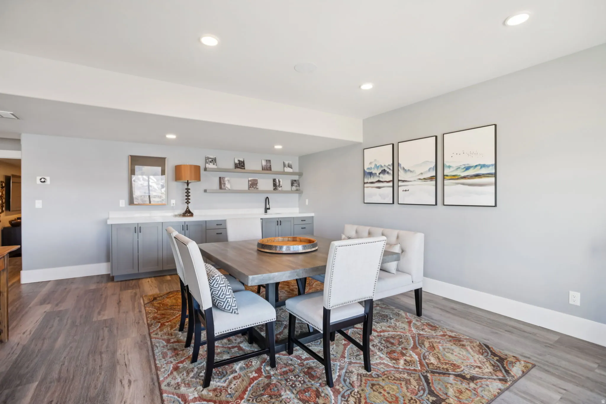 Dining room featuring dark wood finished floors and recessed lighting