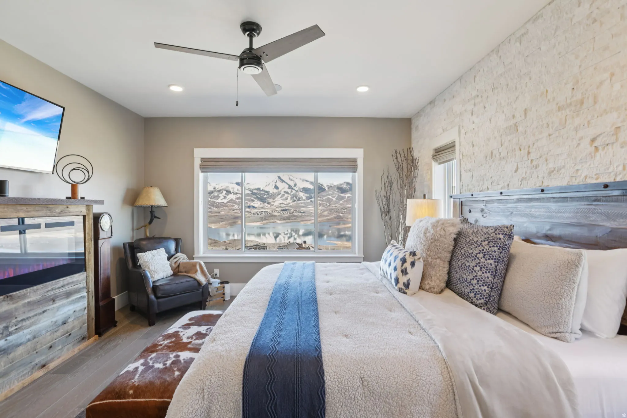 Bedroom featuring wood finished floors, a ceiling fan, and recessed lighting