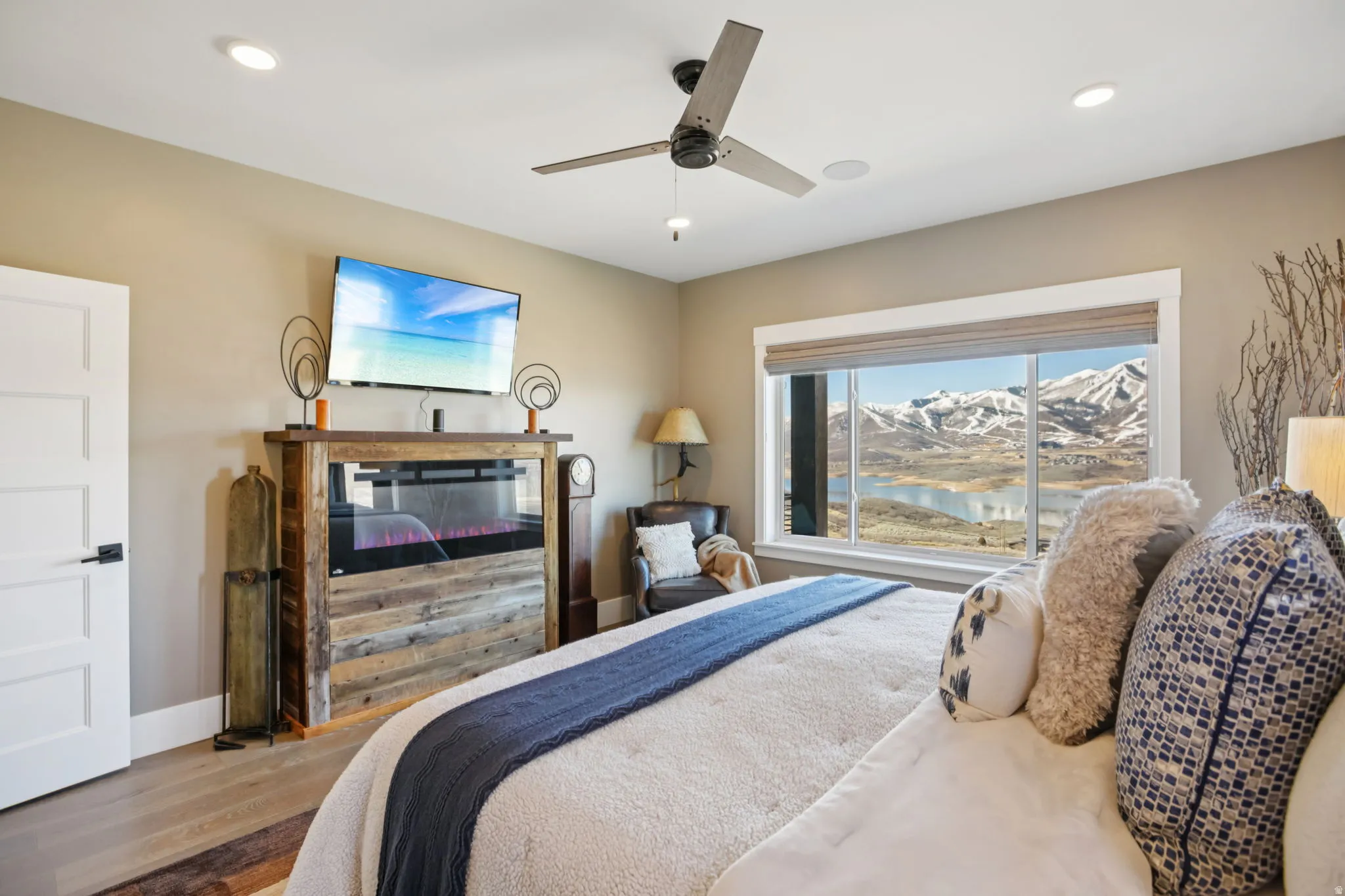 Bedroom featuring wood finished floors, ceiling fan, and recessed lighting