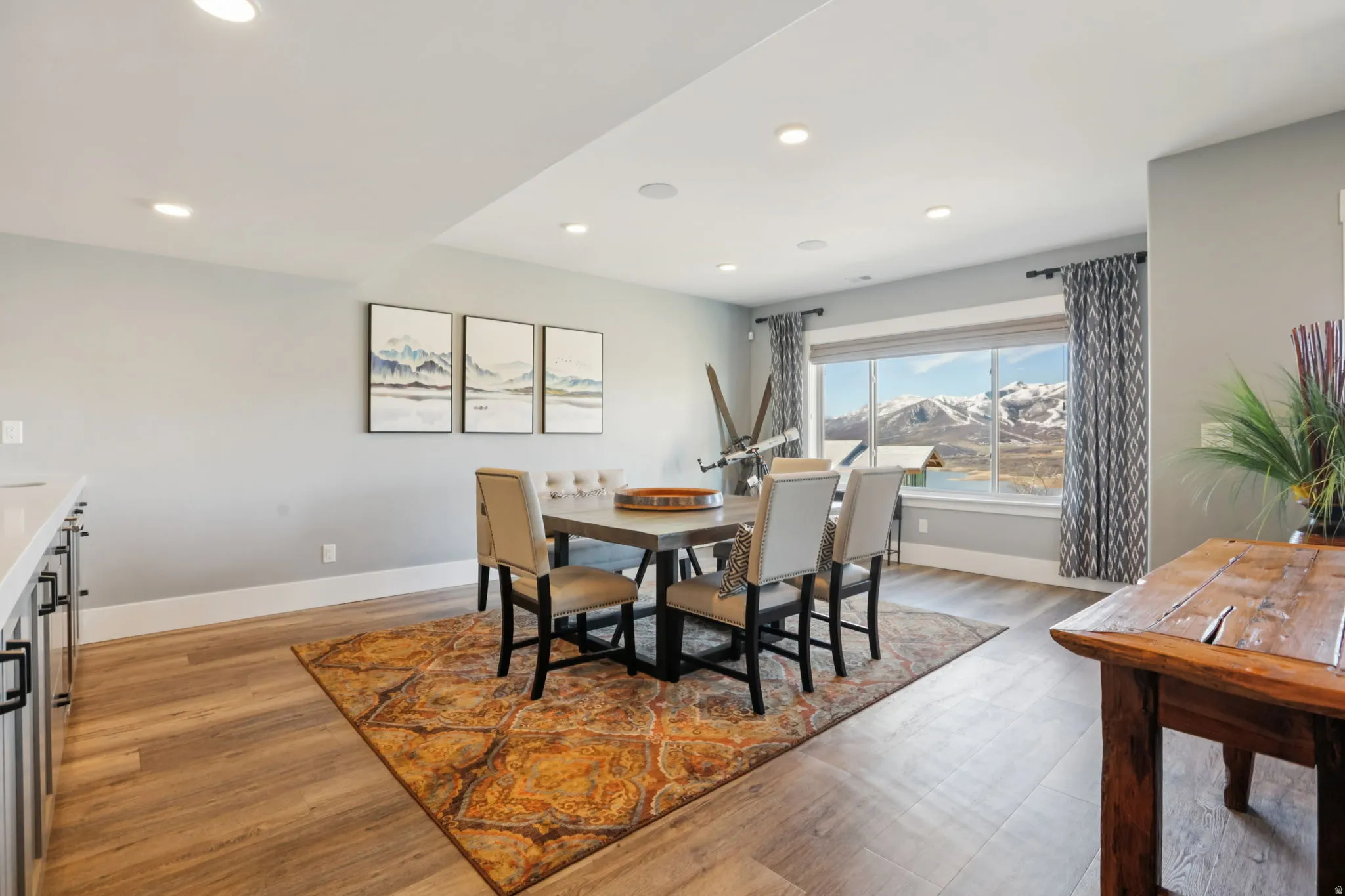 Dining room featuring light wood-style flooring, recessed lighting, and a mountain view