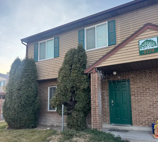 View of front of house featuring brick siding
