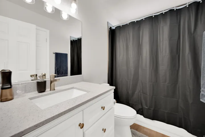 Bathroom with vanity and toilet