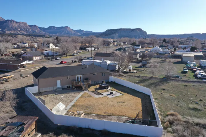 Aerial view of residential area featuring mountains