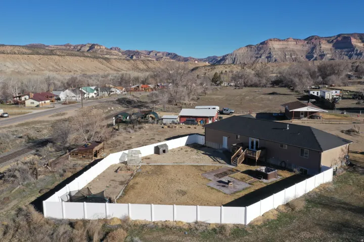 Aerial view of residential area featuring a mountain backdrop