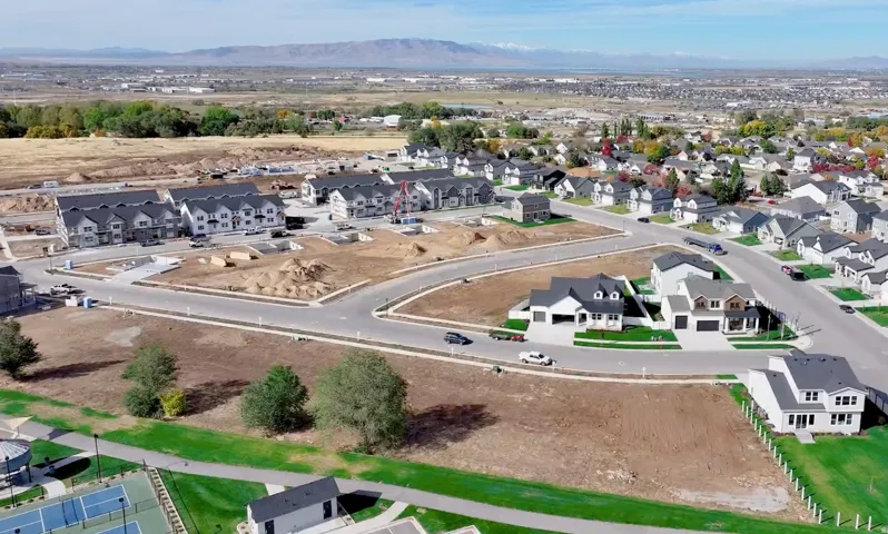 Aerial view of residential area with a mountainous background