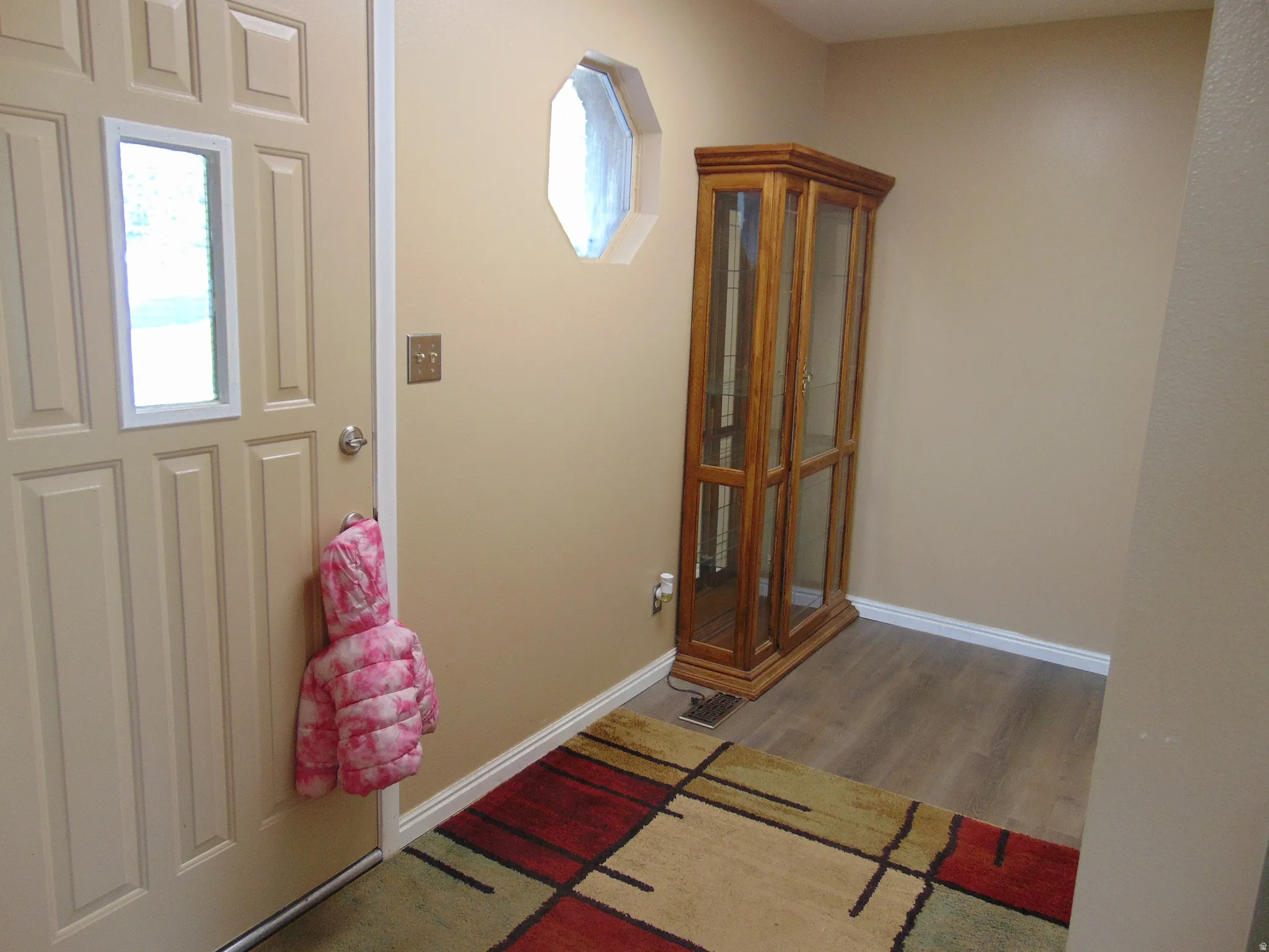 Entryway featuring light wood-style flooring and baseboards
