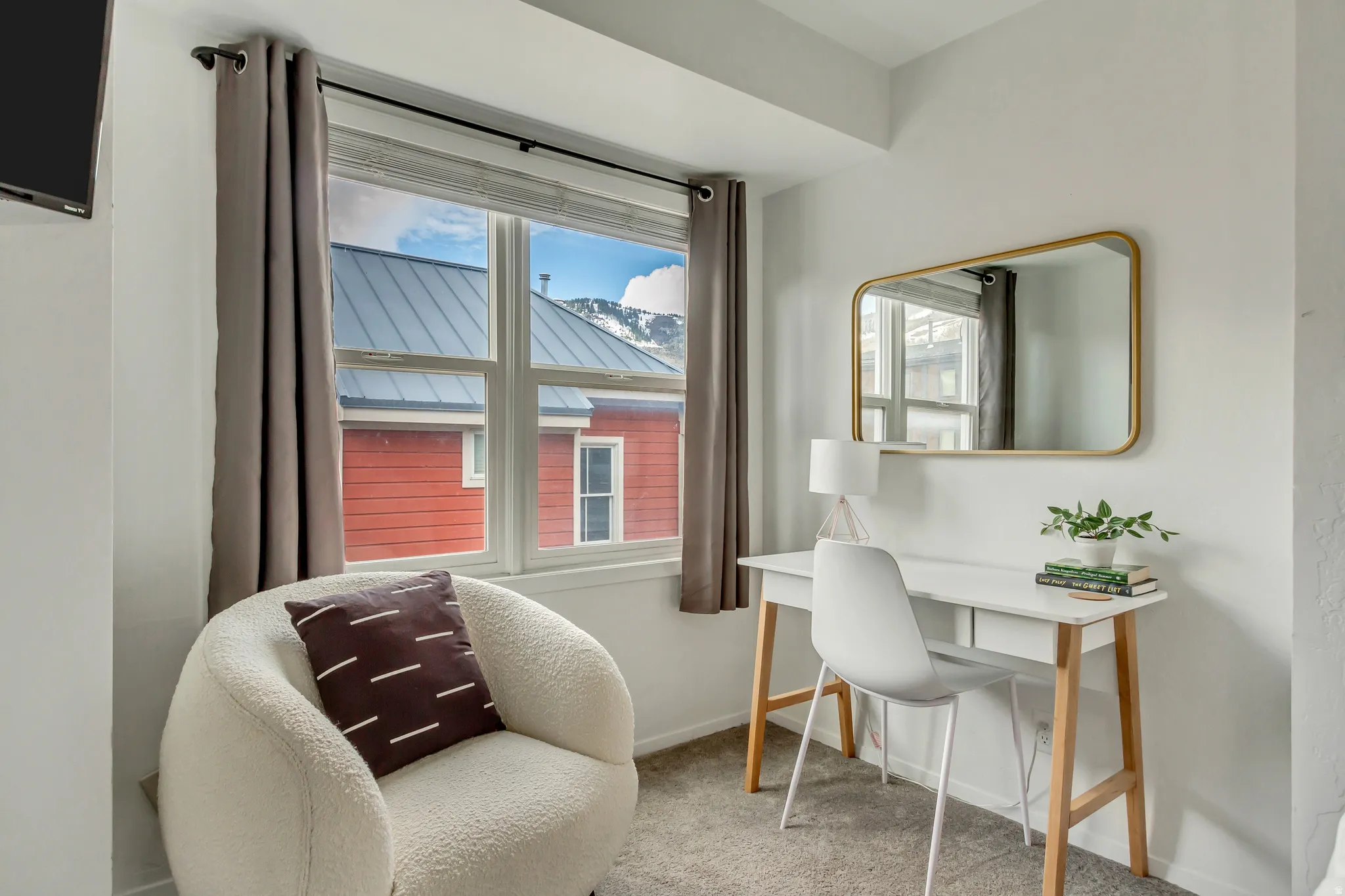 Office featuring light colored carpet, healthy amount of natural light, and a mountain view