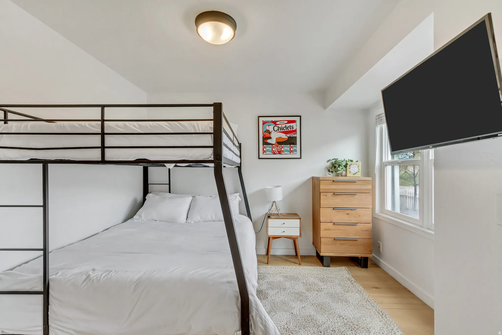 Bedroom featuring baseboards and light wood finished floors