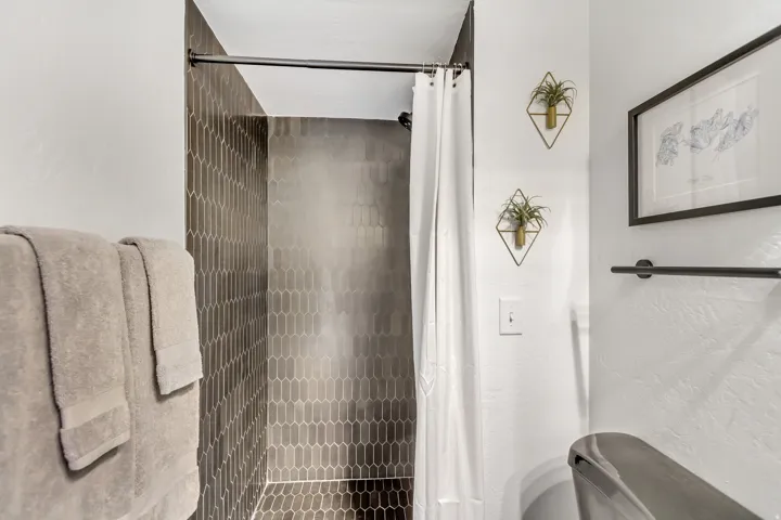 Full bathroom featuring a shower stall