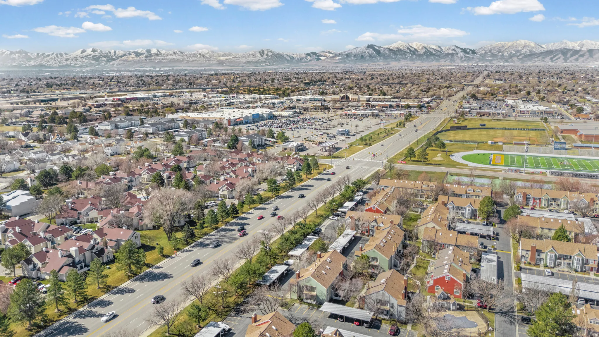 View of property location featuring mountains and nearby suburban area