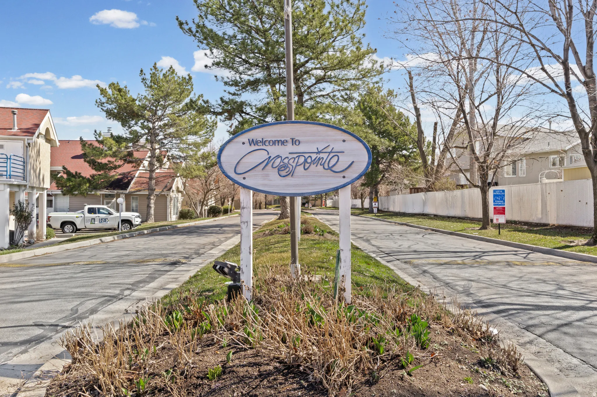 Community / neighborhood sign with a residential view