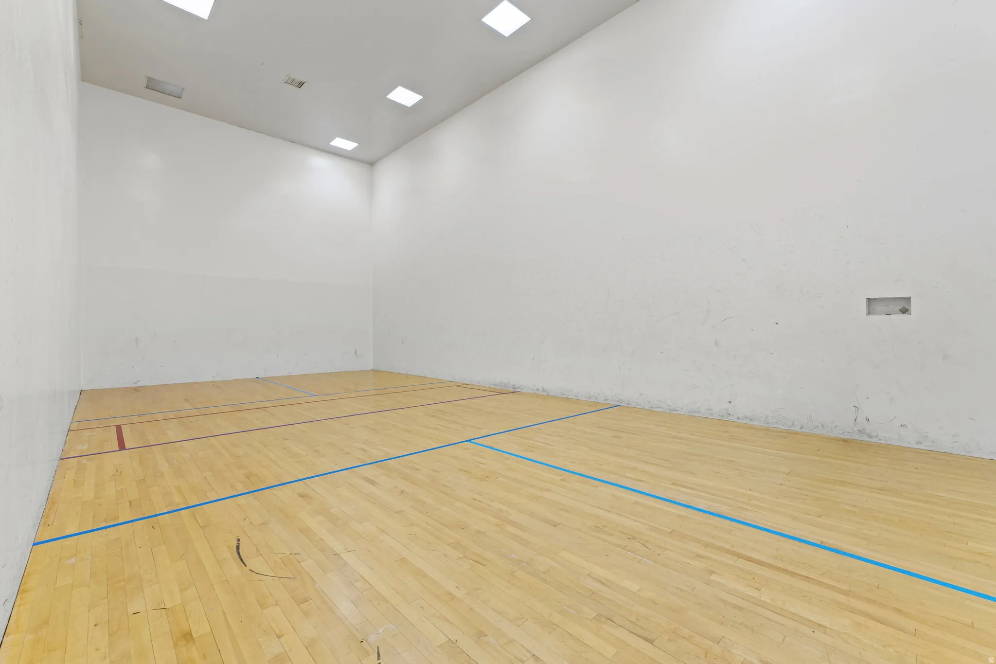 View of property's community with a sport court