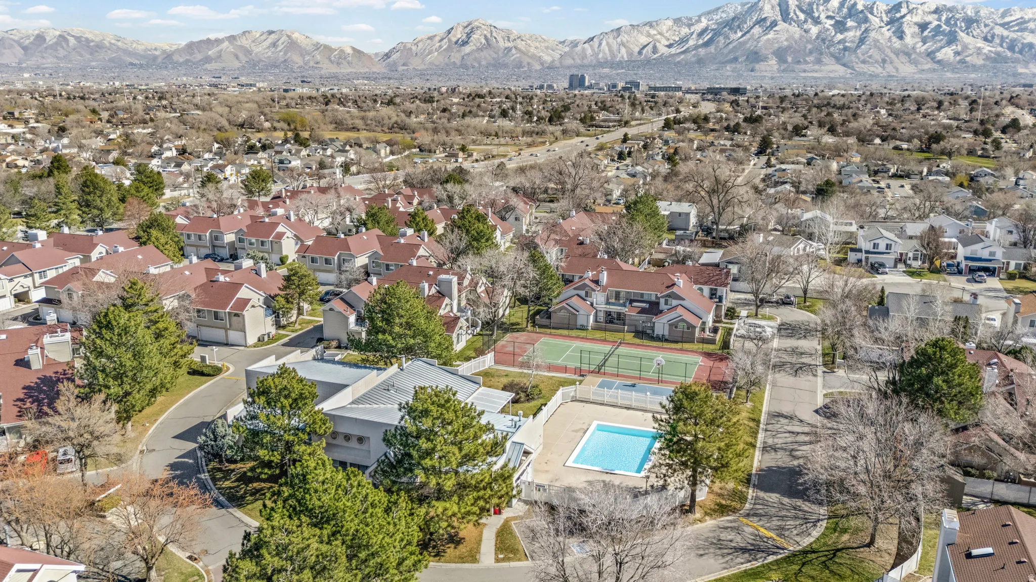 Aerial view of residential area with a mountainous background