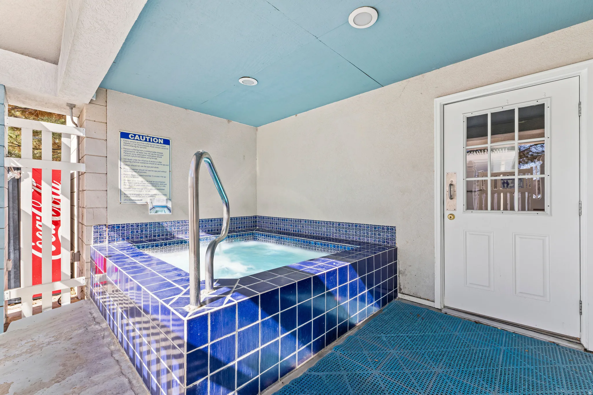 View of pool featuring a hot tub