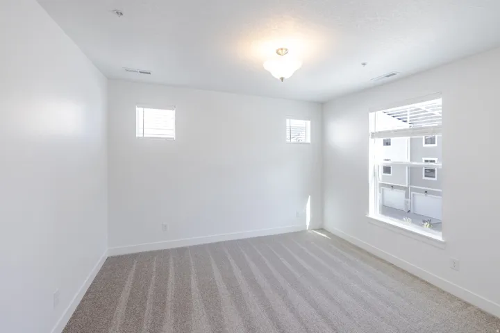 Neutral color palette with textured carpet flooring