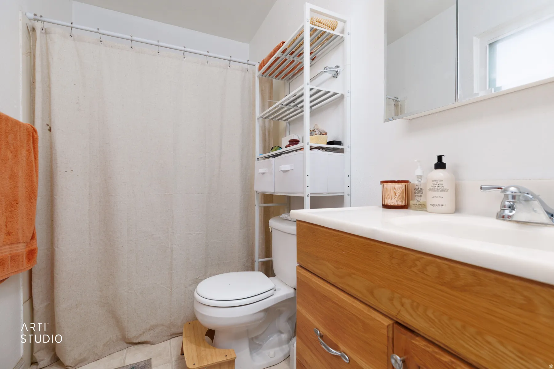 Full bath with a shower with shower curtain, vanity, and light tile patterned flooring