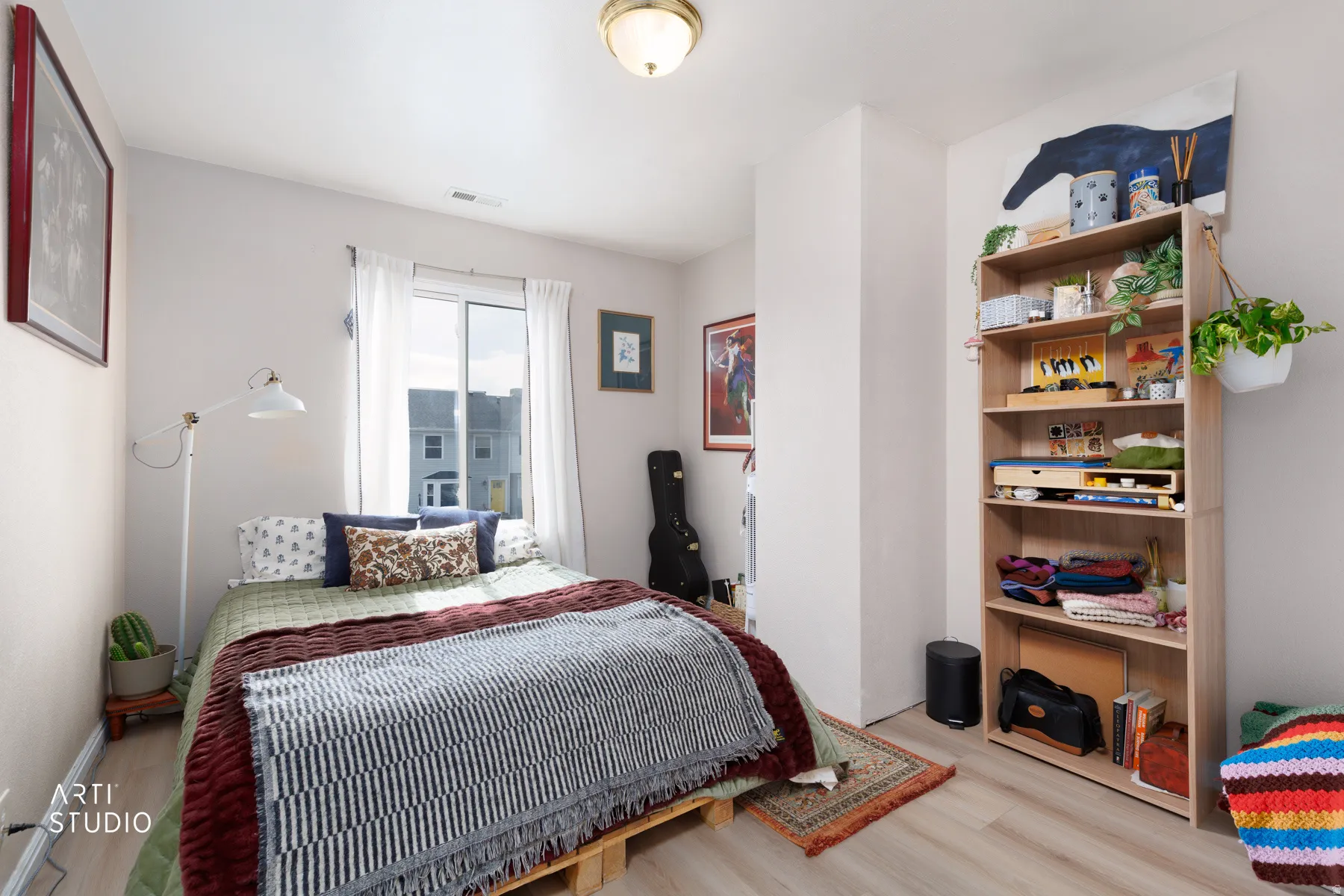 Bedroom with light wood-style floors