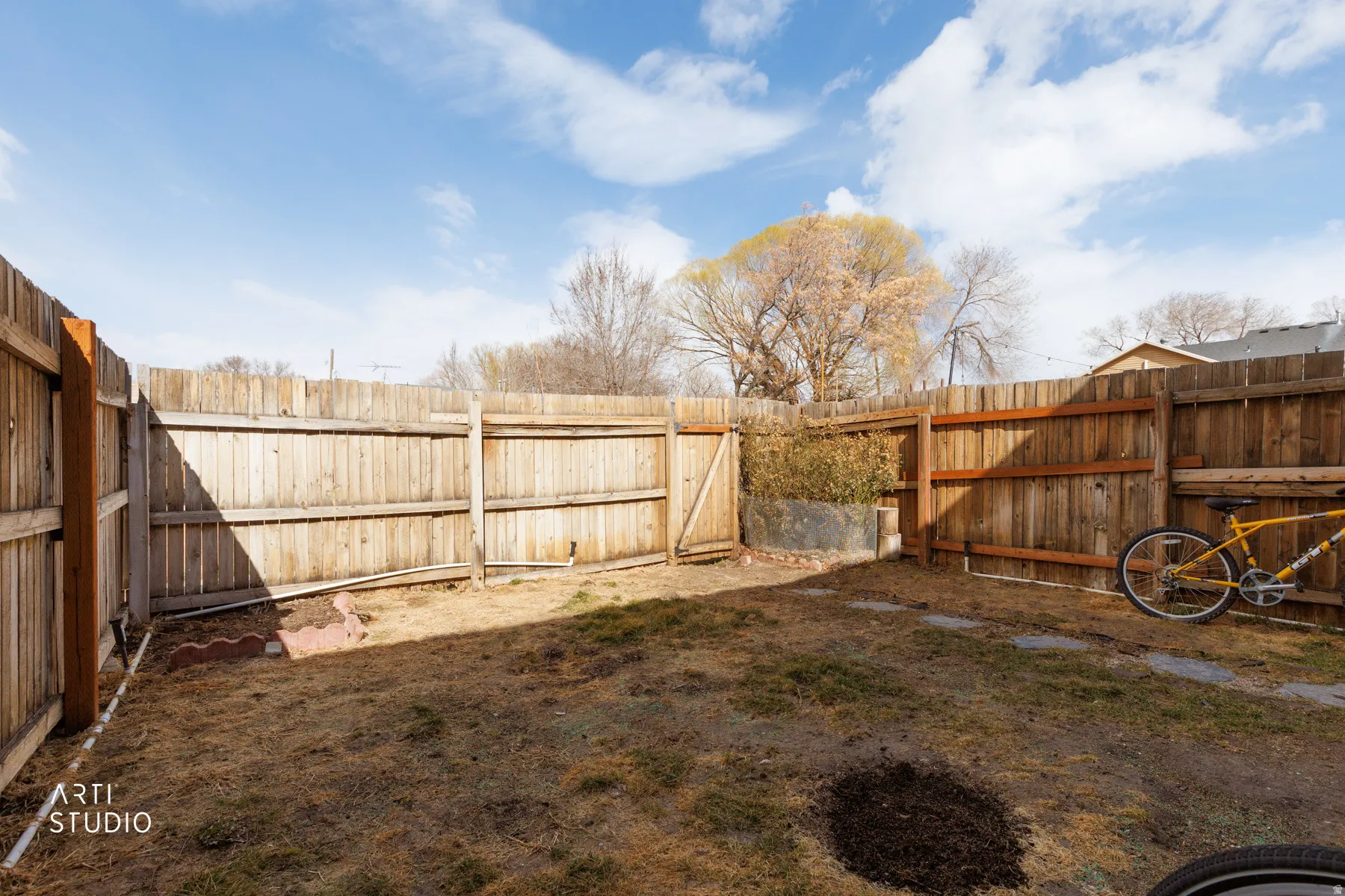 View of fenced backyard