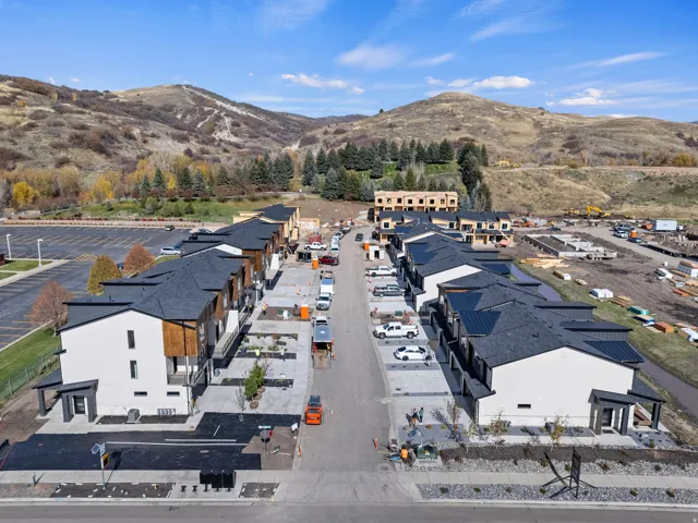 Aerial perspective of suburban area with a mountain backdrop