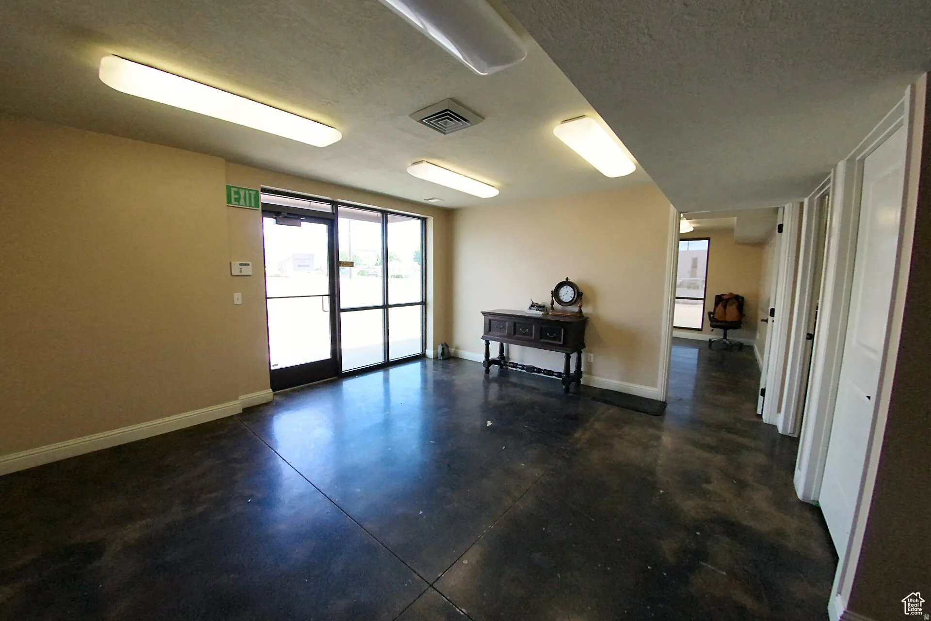 Common area with a textured ceiling