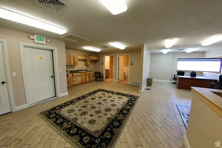 Kitchen with wood finish cabinets and a sink