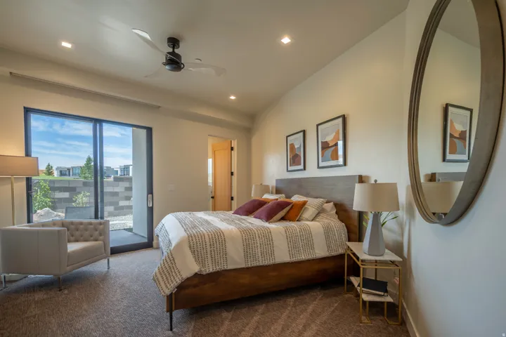 Carpeted bedroom featuring access to exterior, ceiling fan, and recessed lighting