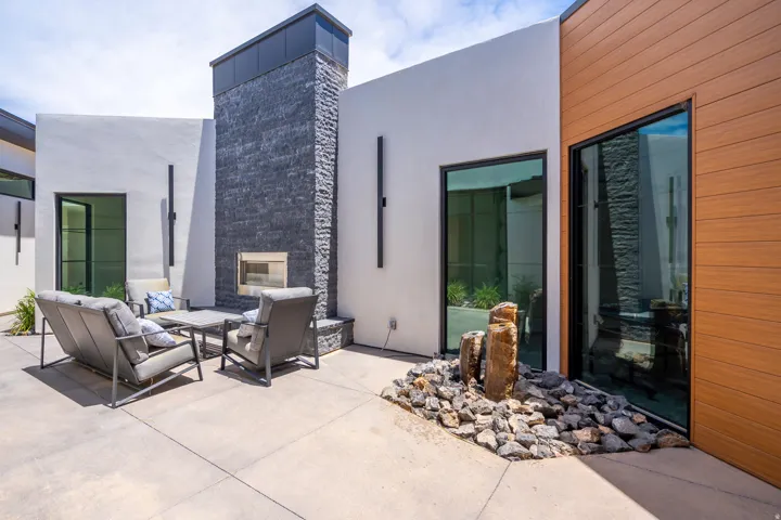 View of patio / terrace featuring an outdoor living space with a fireplace