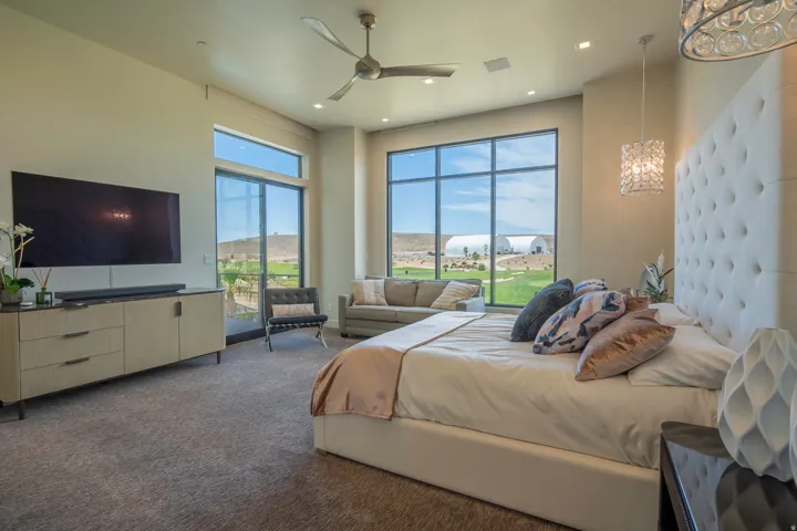 Bedroom with a ceiling fan, dark colored carpet, access to exterior, and recessed lighting