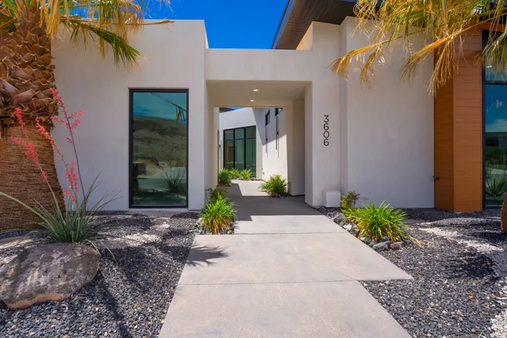 Doorway to property with stucco siding