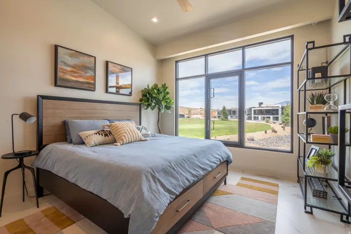 Bedroom featuring ceiling fan, lofted ceiling, and recessed lighting