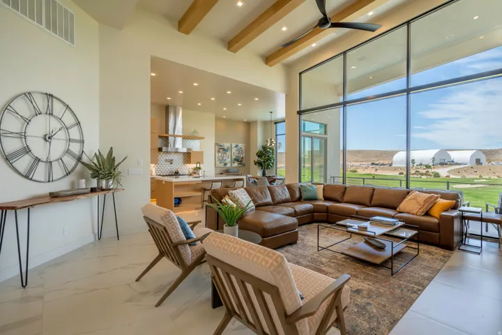 Living area featuring recessed lighting and a ceiling fan