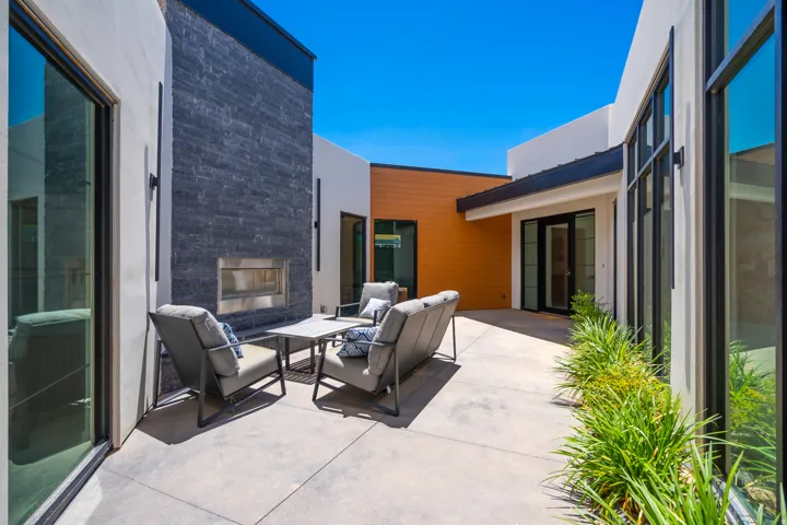 View of patio featuring an outdoor living space with a fireplace