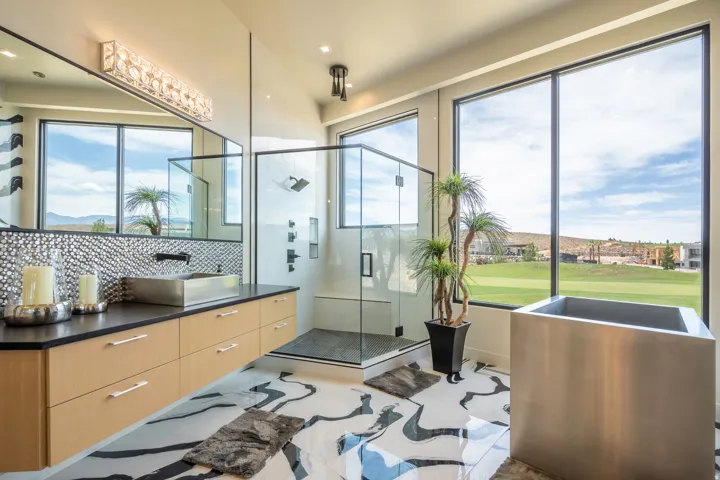 Full bath with a stall shower, vanity, healthy amount of natural light, tasteful backsplash, and recessed lighting