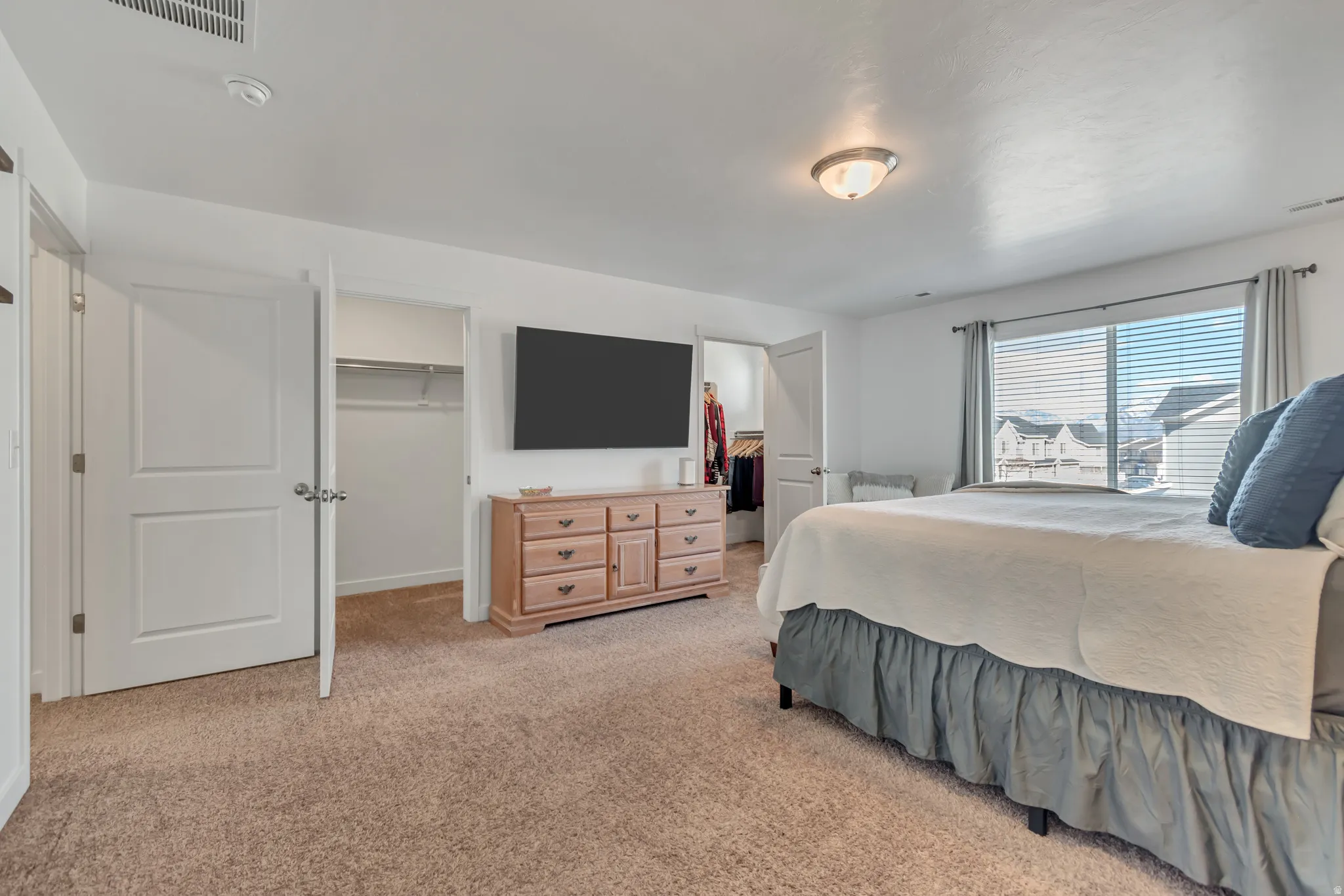 Oversized - extra spacious primary bedroom with two walk-in closets!