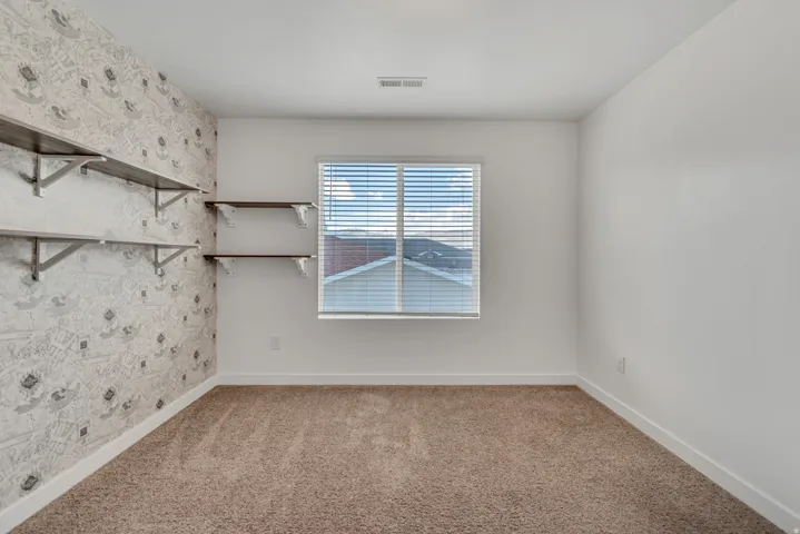 Calling all Harry Potter fans (see the wallpaper!), this would make a great bedroom or office.