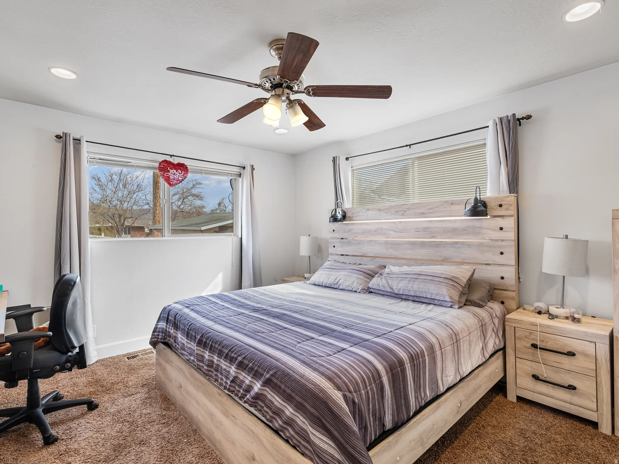 Bedroom featuring carpet, ceiling fan, and recessed lighting