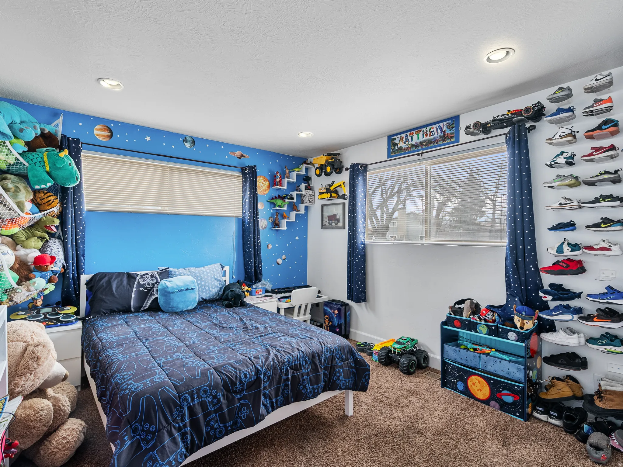 Carpeted bedroom featuring baseboards