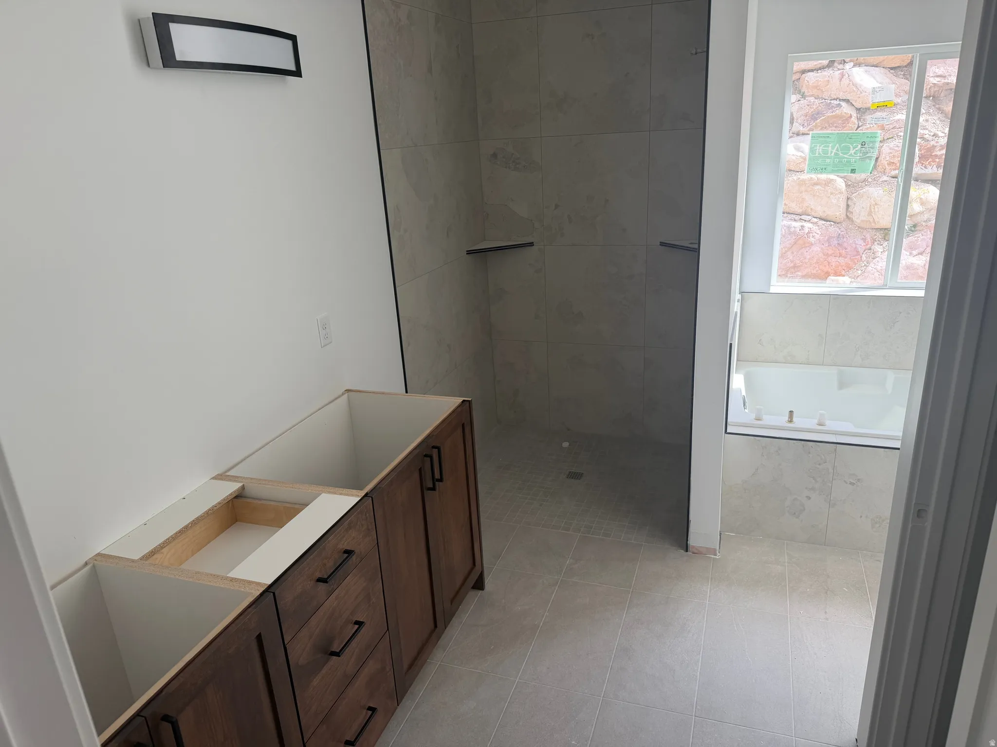 Full bath with vanity, a garden tub, walk in shower, and light tile patterned flooring